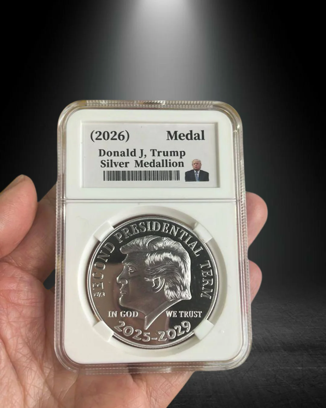 Holding President Trump Silver Medallion
